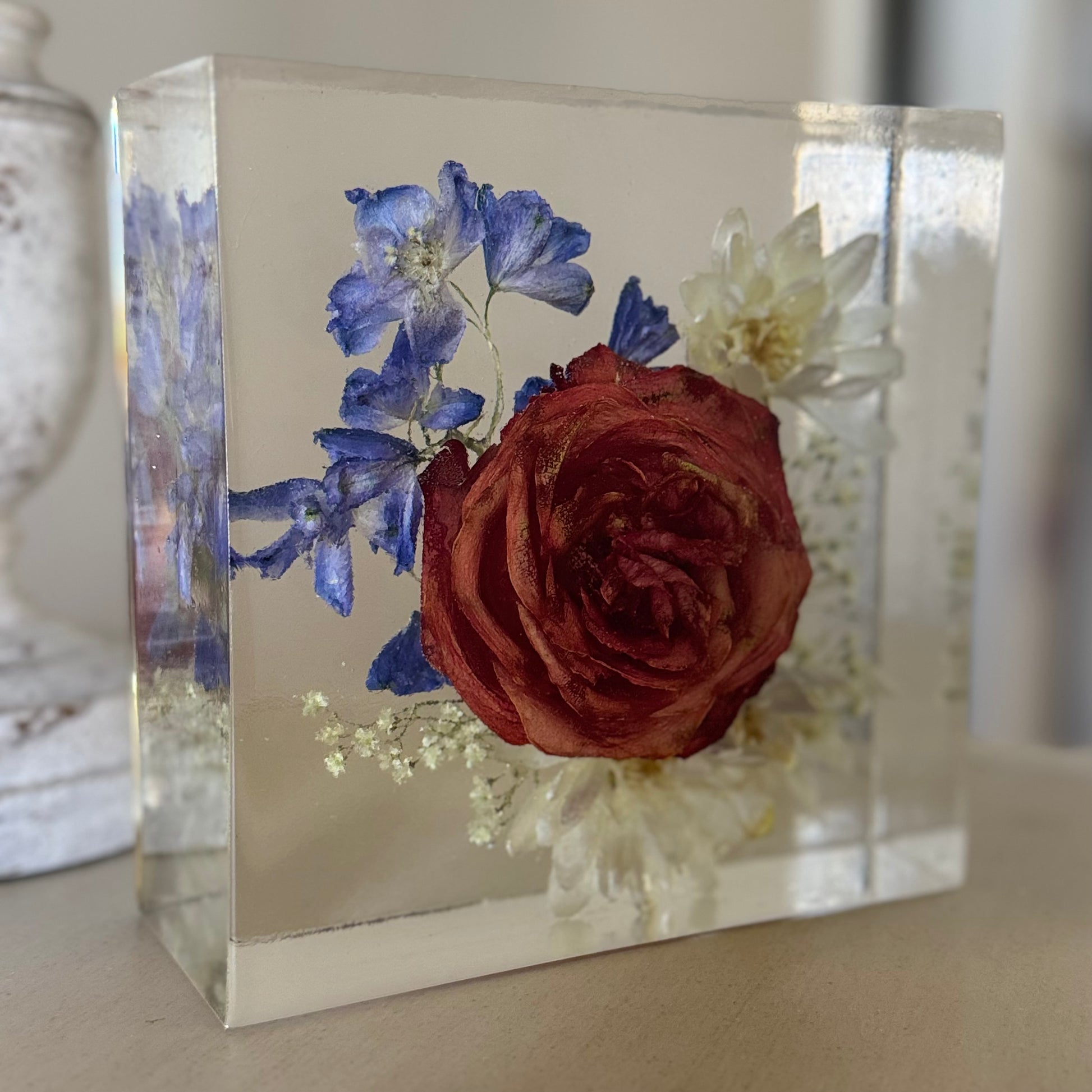 Preserved flowers in a resin block