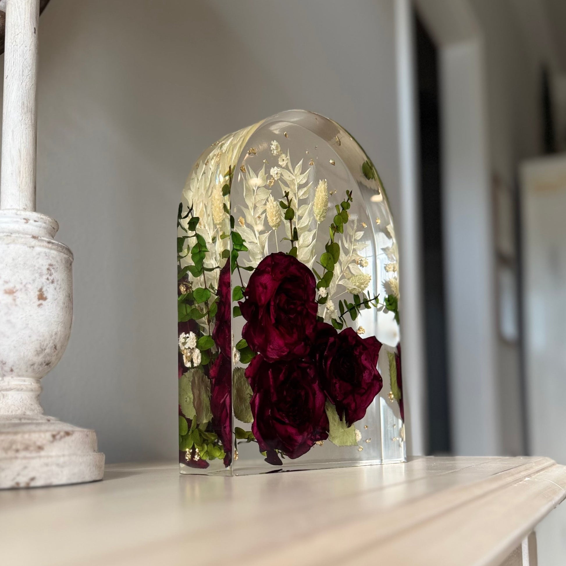 Unique resin arch holding preserved flowers as keepsake