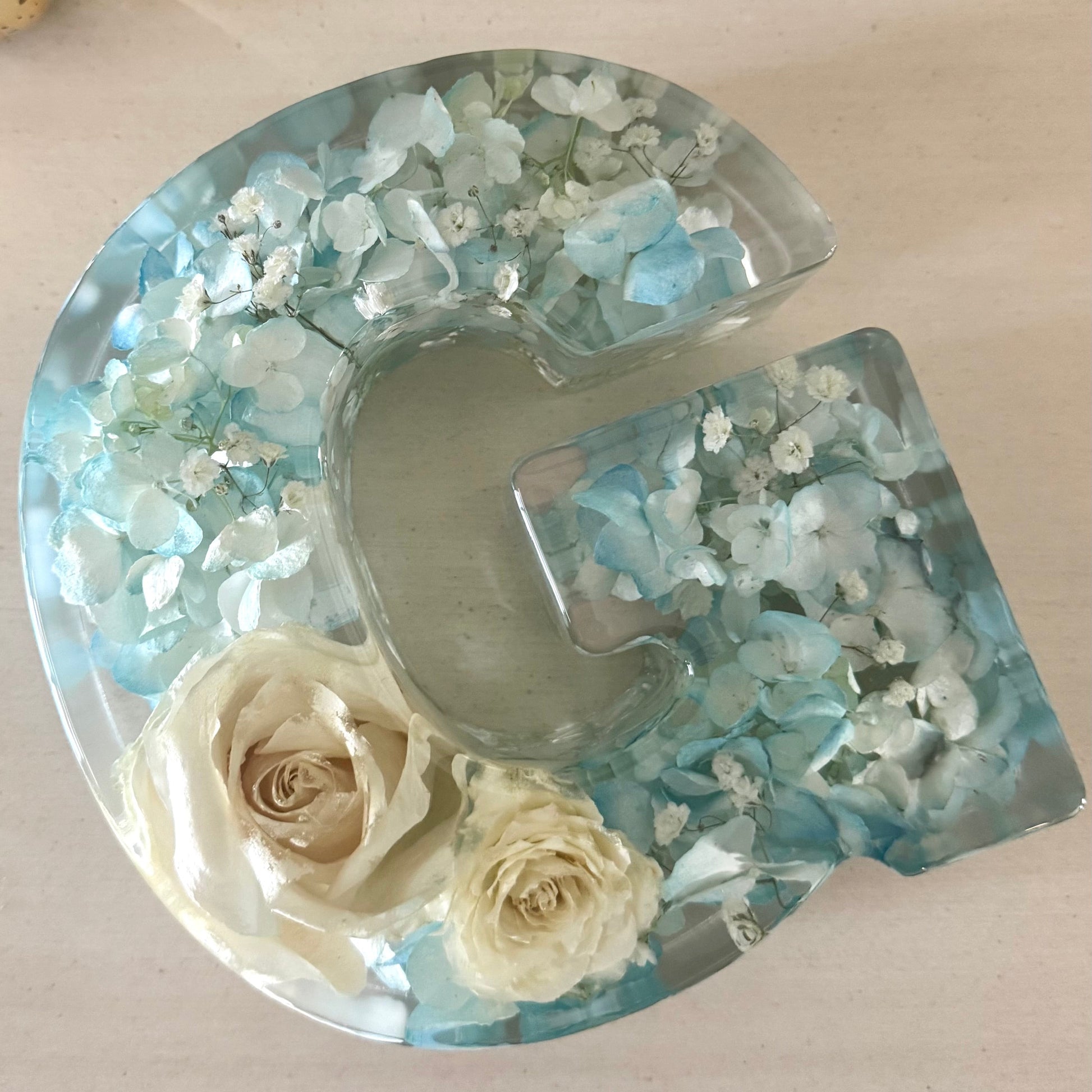 Close up of Floral resin letter by The Blossom Grove featuring real preserved flowers from baby shower